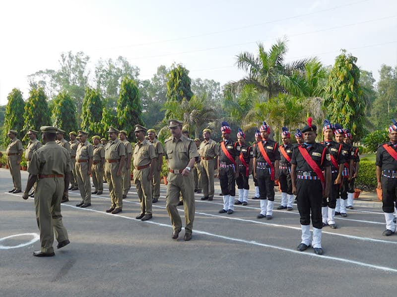 Guards on parade being inspected by an officer