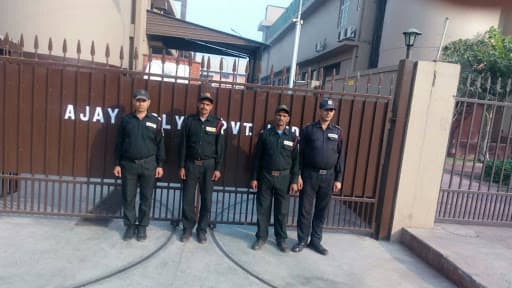 Four Omax guards on duty at the gate of an industrial client